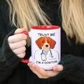 Red ceramic coffee mug with 'Trust Me I'm a Dogtor' text.