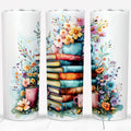 Vintage books and colorful floral design on a 20oz stainless steel tumbler with a plastic straw.