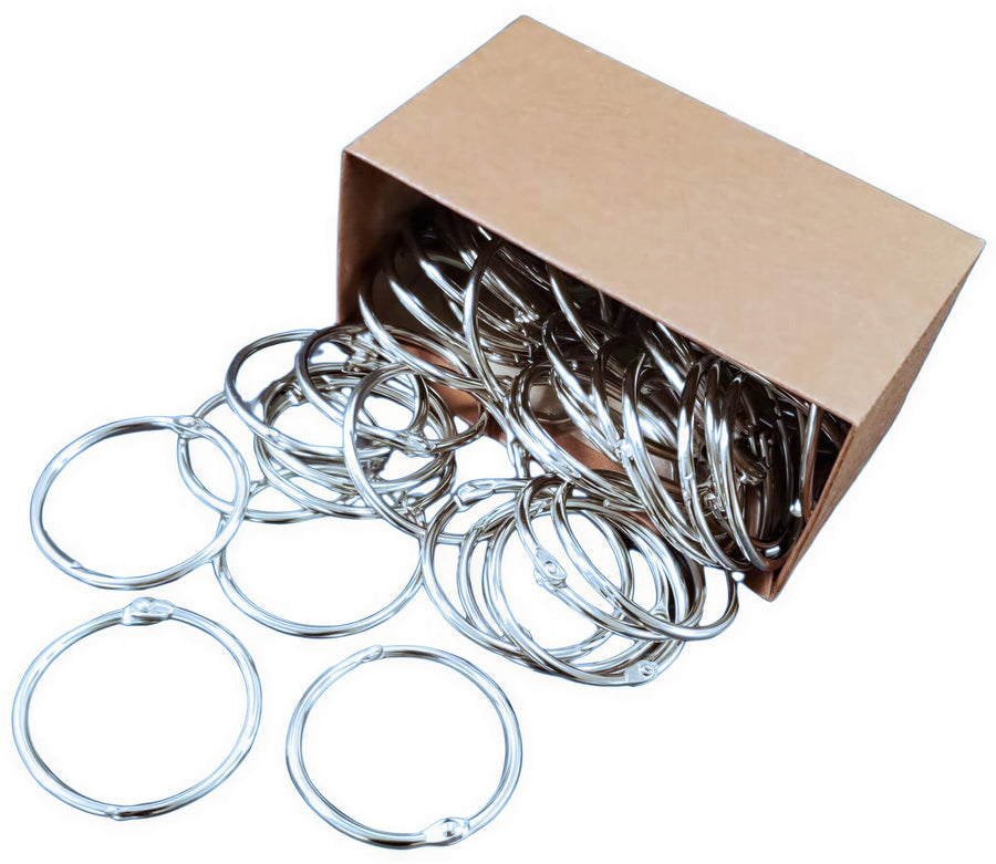 Metal binder rings in a brown box, with several rings visible, designed for index cards or flashcards.