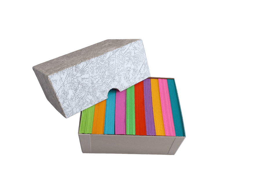 Close-up of bright 2 x 3.5 inch mini index cards by Debra Dale Designs fanned out to show assorted colors.