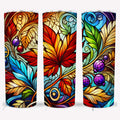 Autumn stained glass tumbler featuring vibrant fall leaves and berry designs in red, orange, and blue hues.