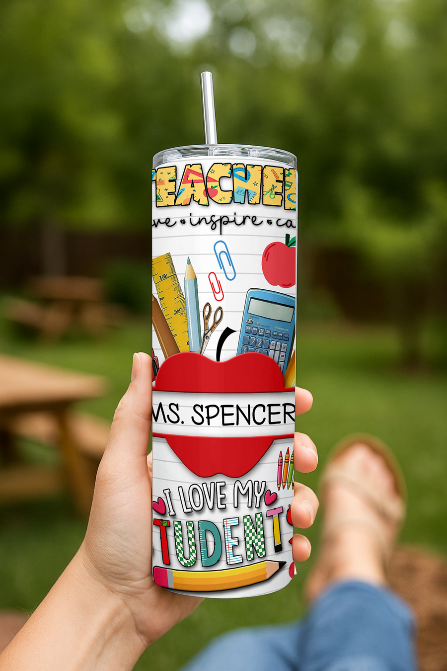Personalized 20oz stainless steel travel cup featuring colorful teacher-themed designs and the text "Ms. Spencer I love my...