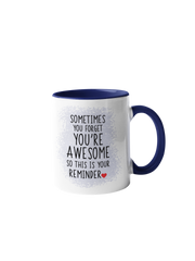 “Sometimes you forget you're awesome” mug with navy blue handle and rim, featuring black text on a white background.
