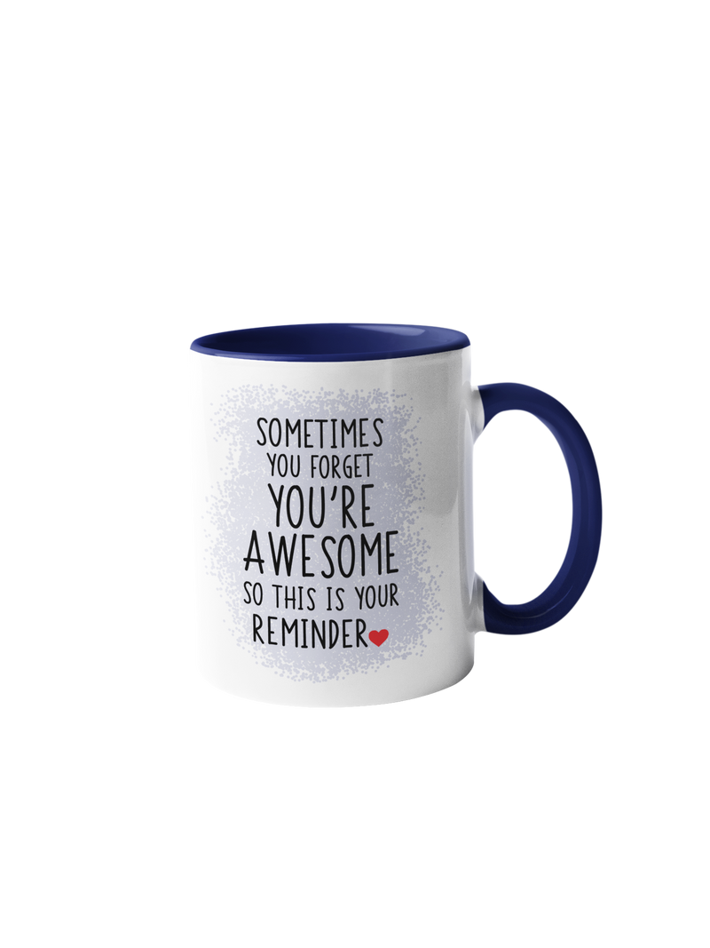 “Sometimes you forget you're awesome” mug with navy blue handle and rim, featuring black text on a white background.