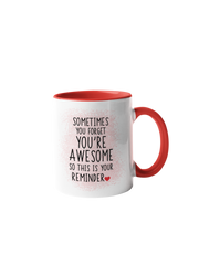 “Sometimes you forget you're awesome” coffee mug with a white body and red handle, featuring black text design.