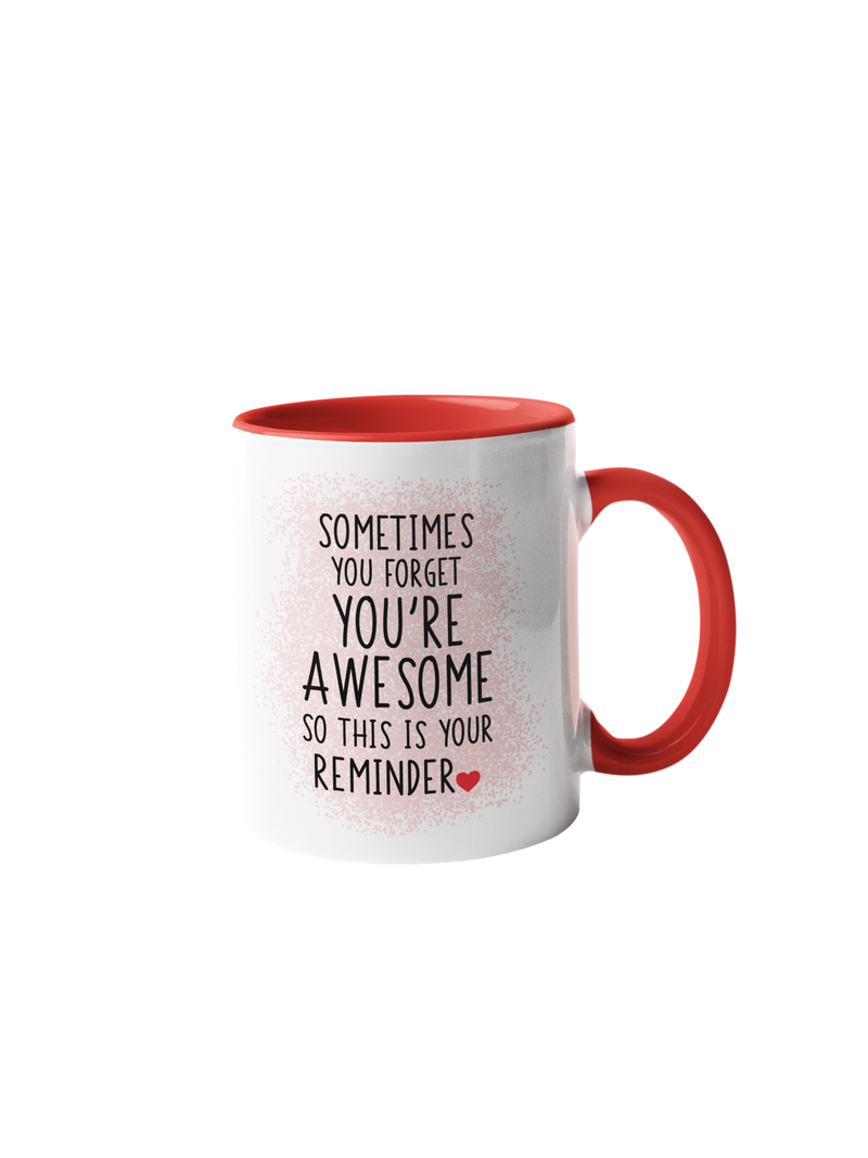 “Sometimes you forget you're awesome” coffee mug with a white body and red handle, featuring black text design.