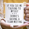White ceramic mug with 'If You See Me Talking to Myself' quote.