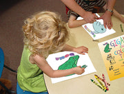 Cover of animal coloring and spelling activity pad with included crayons